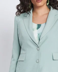 Giacca con pattine ed inserti asimmetrici in pizzo ALOE