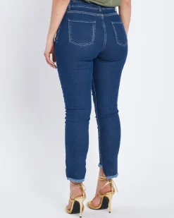 Jeans slim con orlo asimmetrico sfrangiato DENIM
