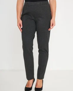 Pantaloni slim fit con vita elastica e dettaglio frontale di piega di